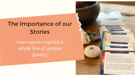 Seashells and beach pebbles beside this Beautiful Deck of Daily Inspiration Cards by Morning Moon Jewelry