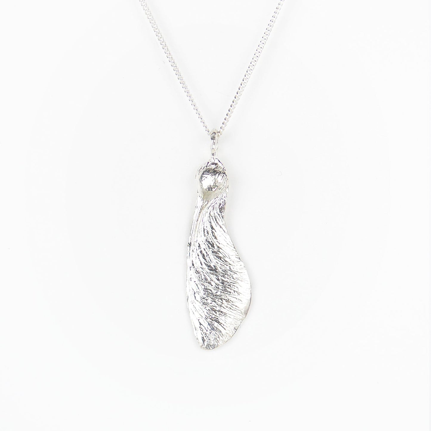 solo maple key necklace "helicopter" in silver on a white background
