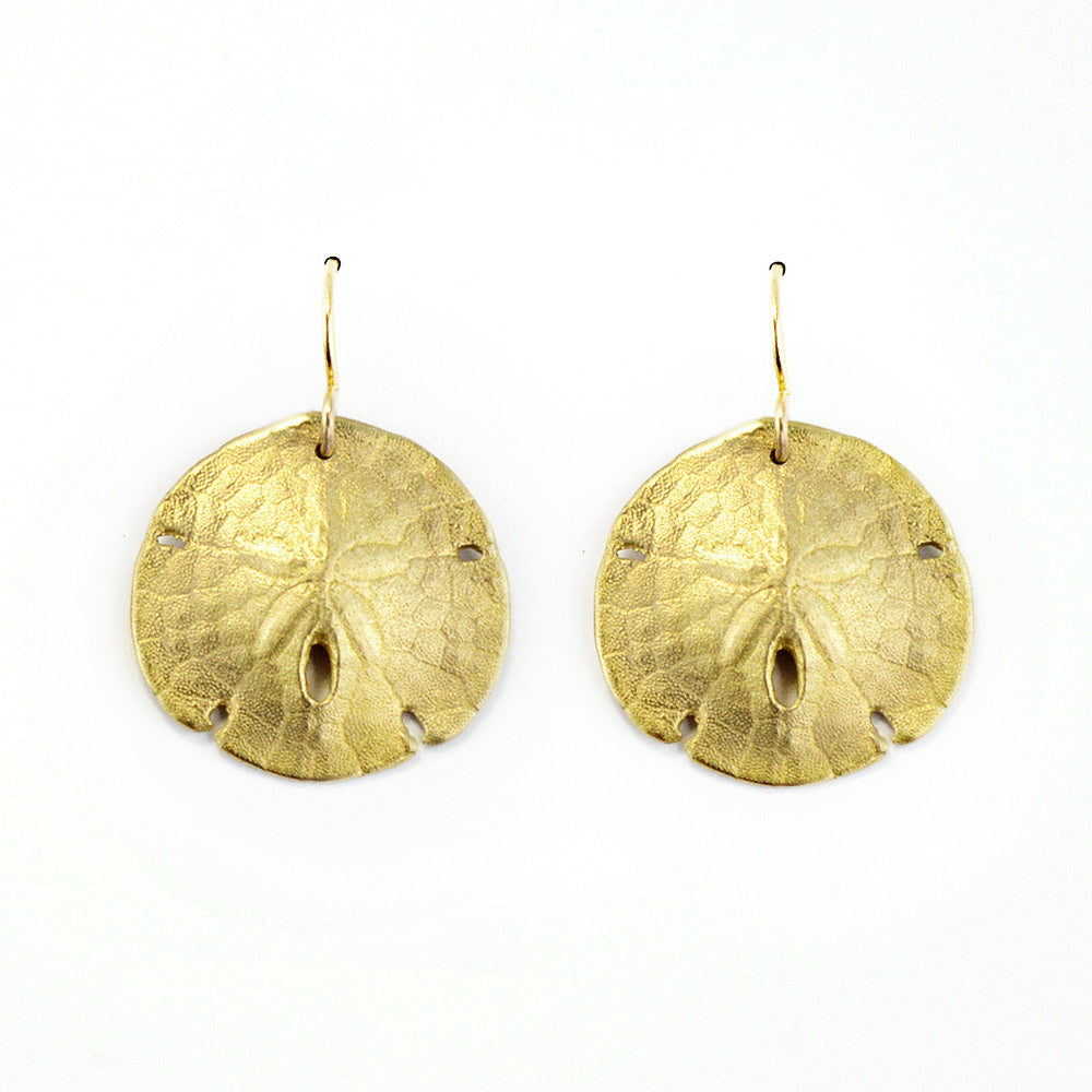 golden bronze sand dollar shell earring on a white background