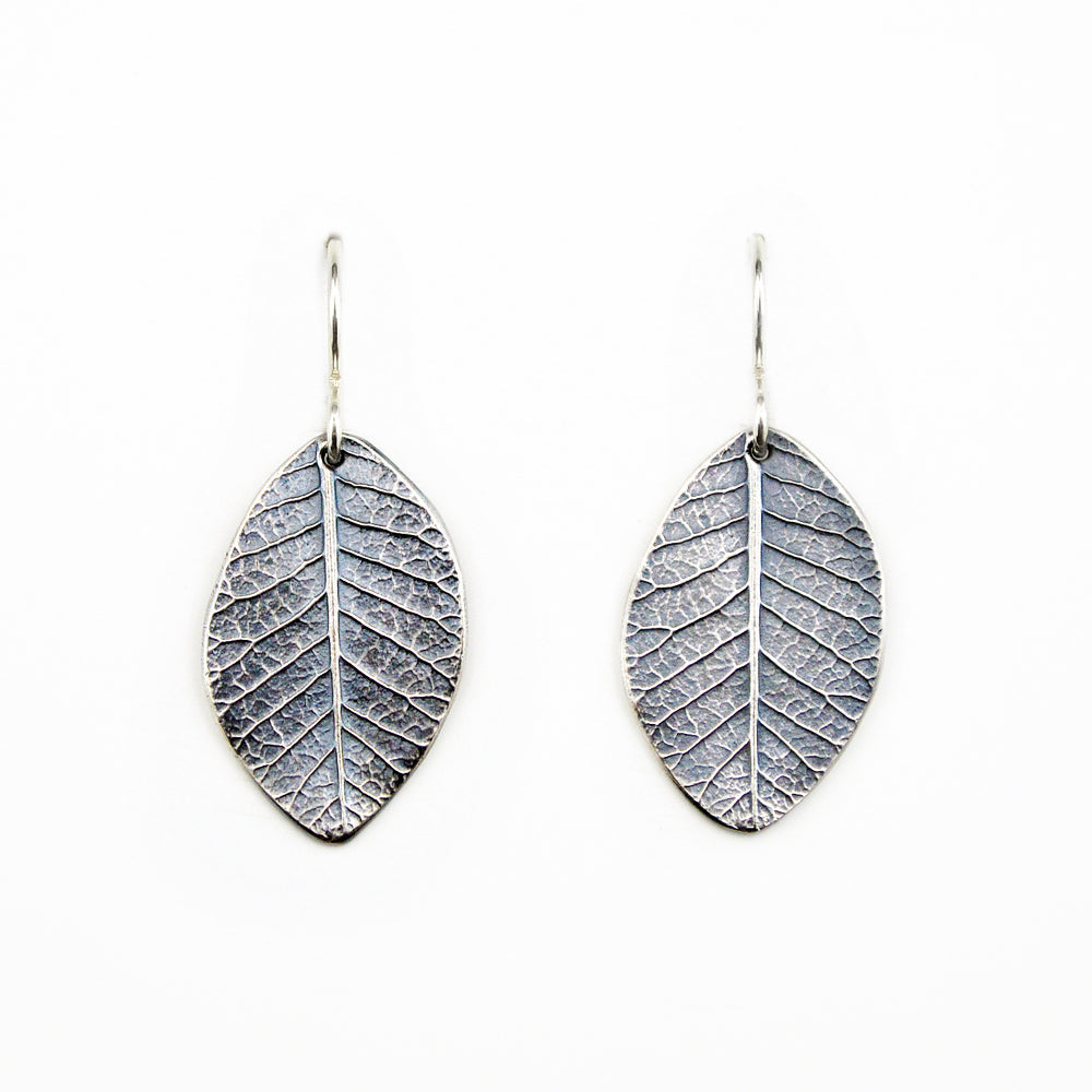 beautifully detailed oxidized sterling silver smokebush earrings on a white background