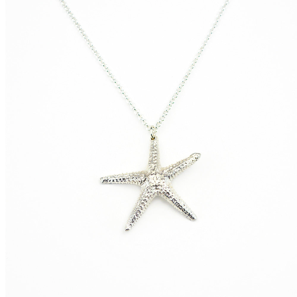 starfish pendant in sterling silver on white background