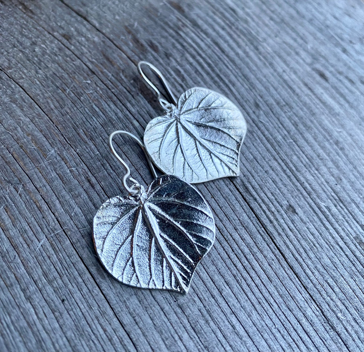 beautiful pair of linden leaf earrings in sterling silver.