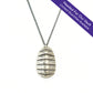 "headed for our vault. Limited quantities available" Oxidized silver chiton shell pendant necklace on white background