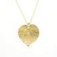 golden linden necklace pendant on white background