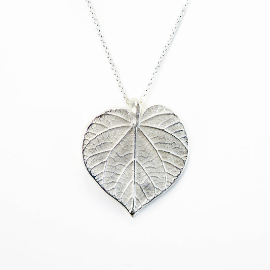 silver linden leaf necklace on white background