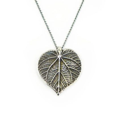 oxidized silver linden necklace on white background