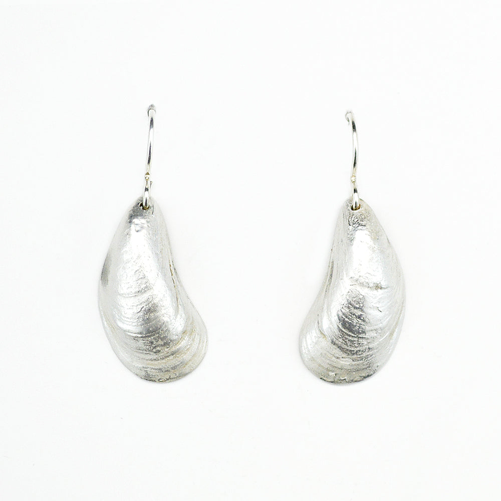 pair of sterling silver mussel shell earrings on white background