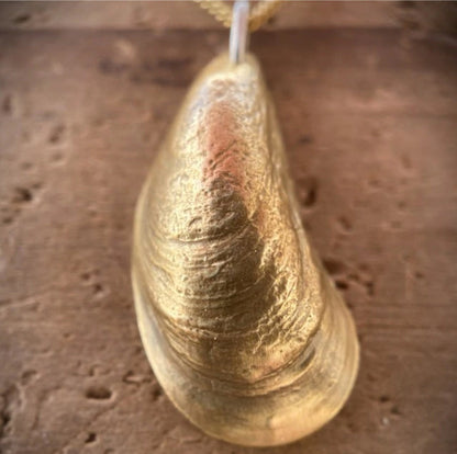 up-close on a beautiful golden bronze mussel pendant necklace