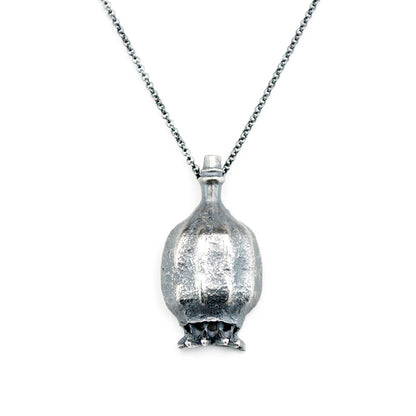 poppy seed pod necklace in oxidized silver. On a white background