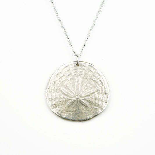 sterling silver sand dollar pendant necklace on white background