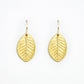 beautifully detailed golden bronze smokebush earrings on a white background