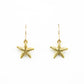 small golden bronze starfish earrings on a white background