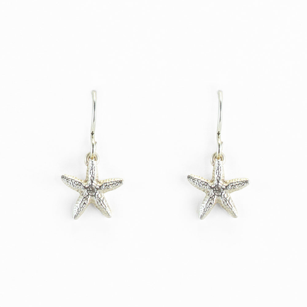 small sterling silver starfish earrings on a white background
