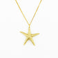 starfish pendant in golden bronze on white background