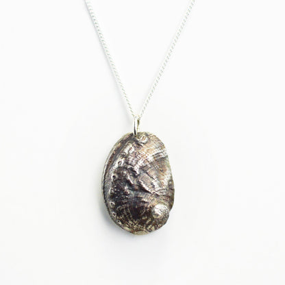 oxidized silver abalone shell necklace on white background