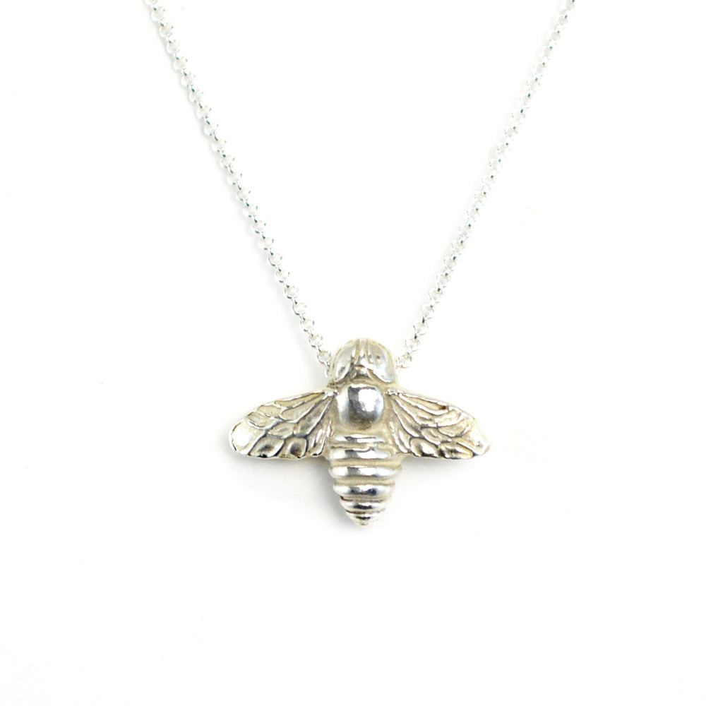 sterling silver bee pendant on white background