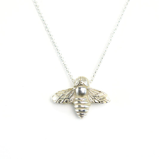 sterling silver bee pendant on white background