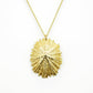 beautifully detailed limpet pendant necklace in golden bronze on white background